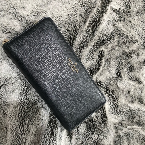 A White Kate Spade Purse with black wallet. - Picture 2 of 2